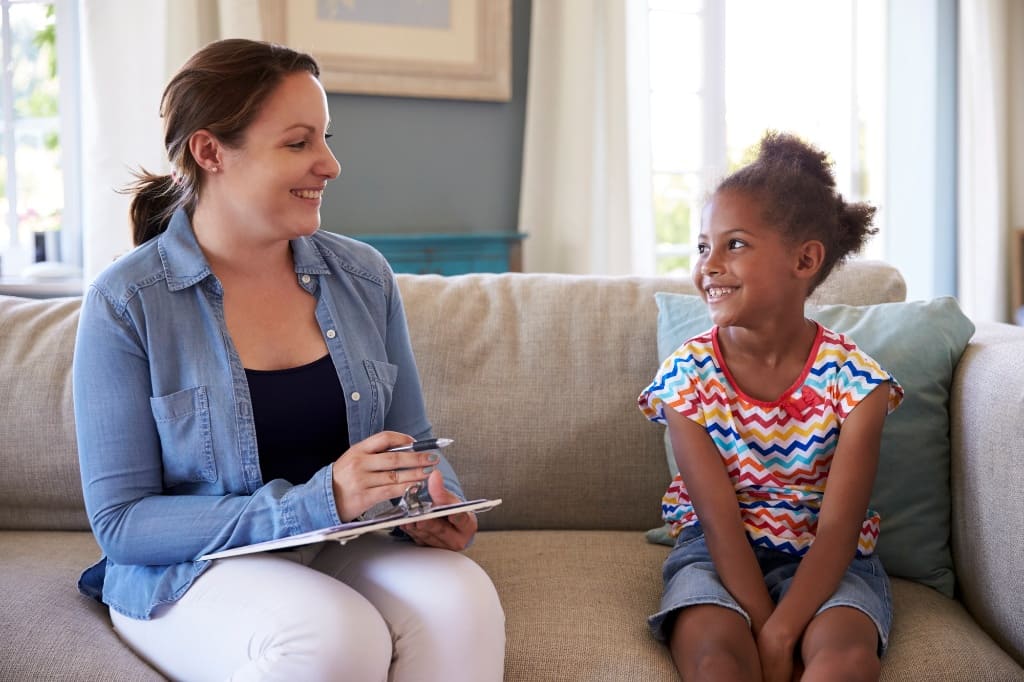 Lawyer Discussing With Her Client's Daughter