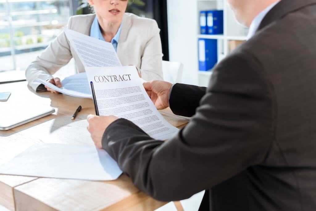 Lawyers Holding A Legal Doc